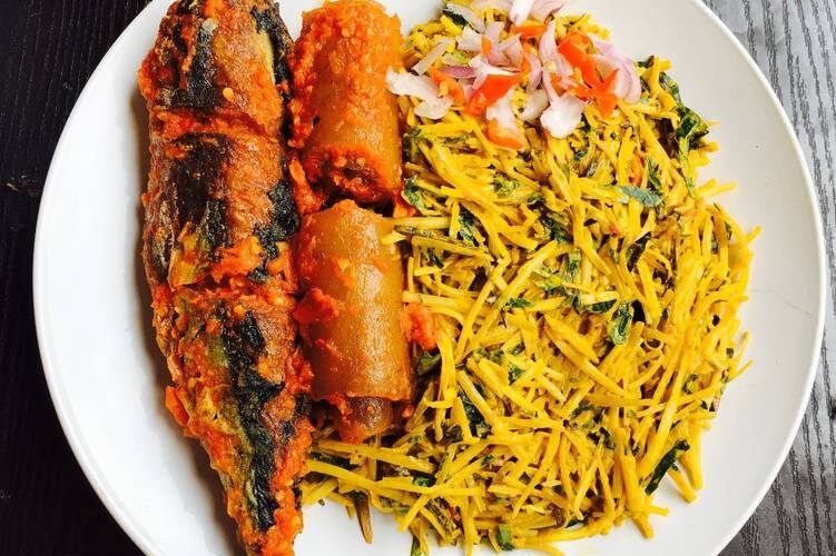 A plate of abacha with fish and pomo